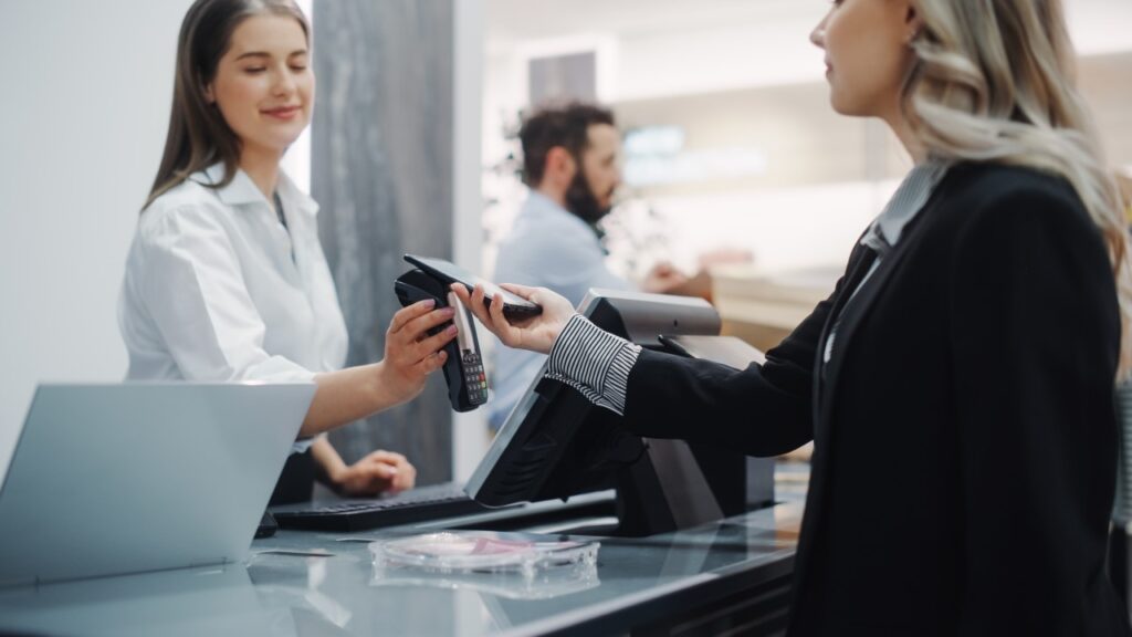 Woman paying using phone