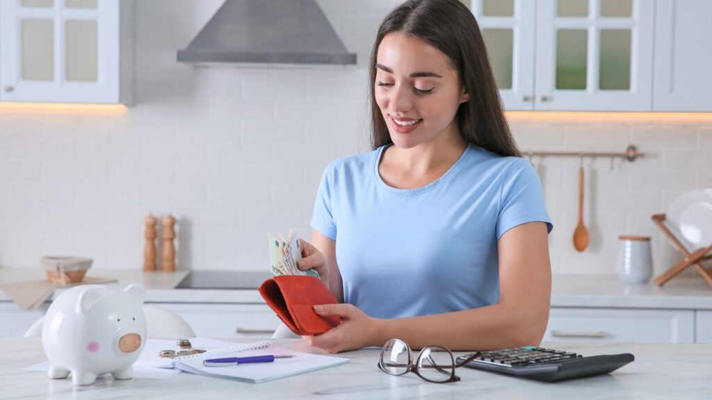 Woman smiling dealing with finances