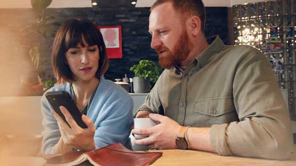 Couple looking at smartphone